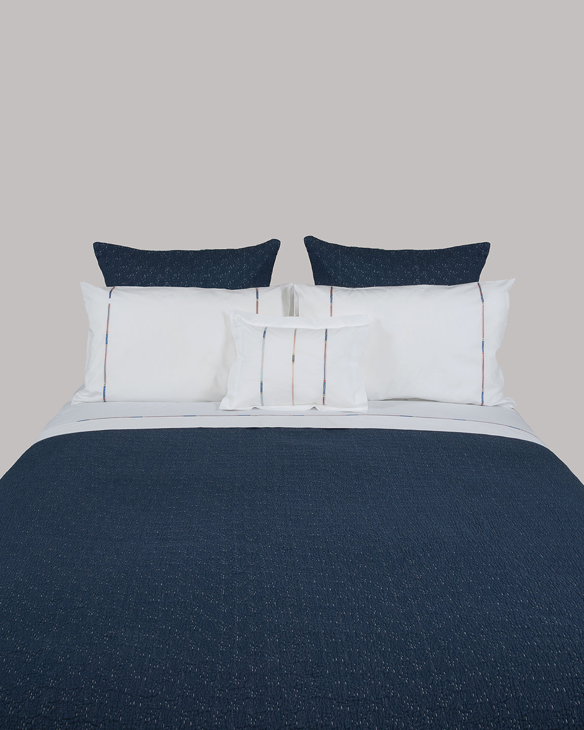 Stripe bed shown with Boutis in Indigo